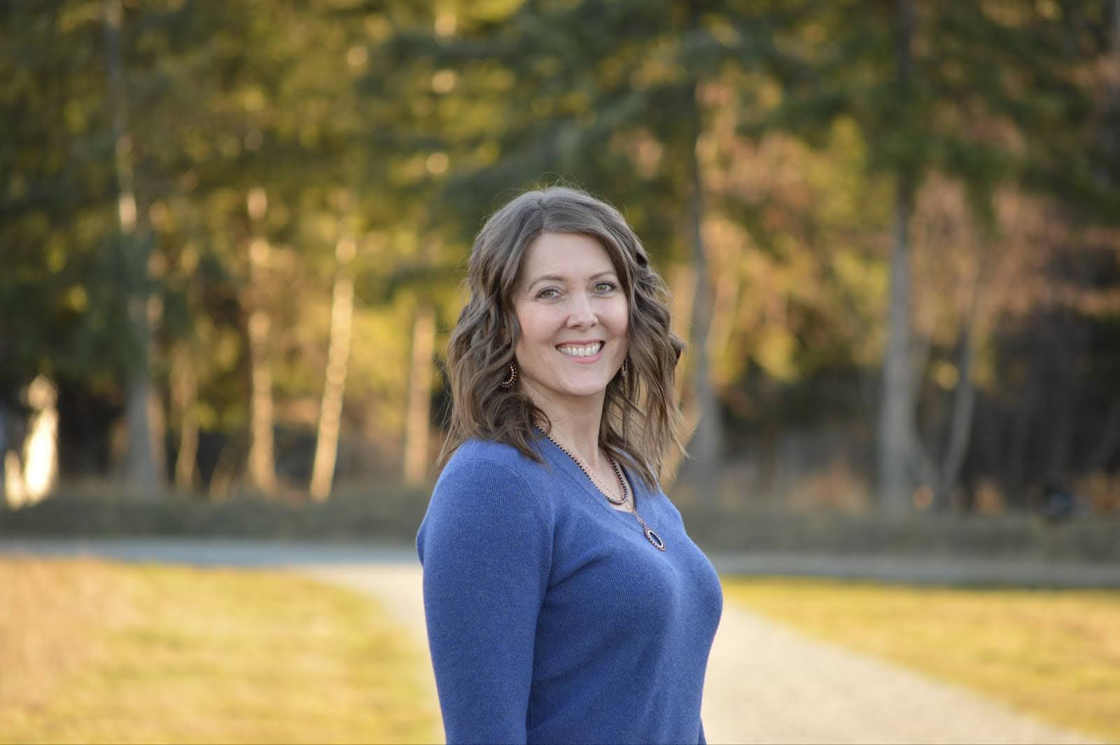 Woman in hammock using laptop.