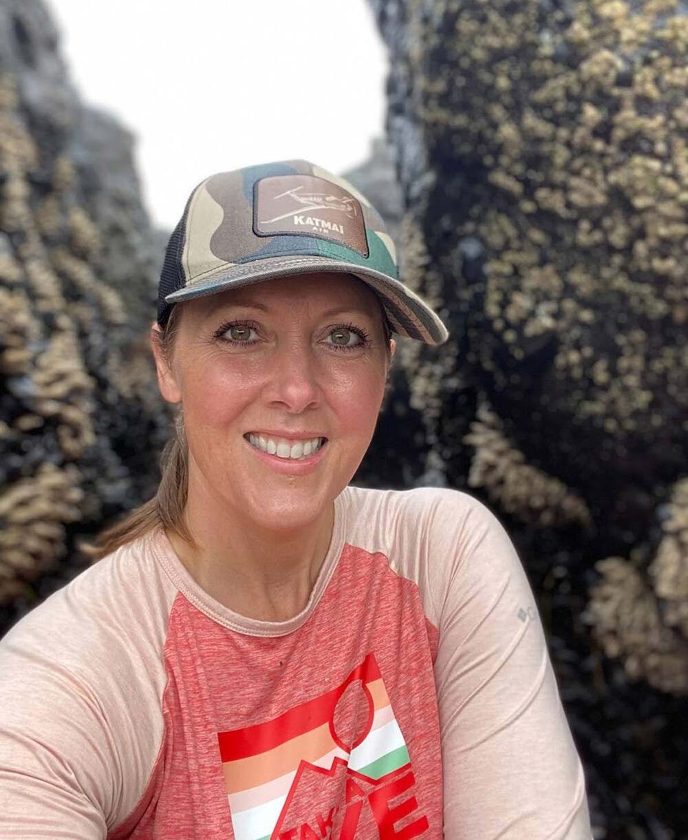 Woman in hammock using laptop.