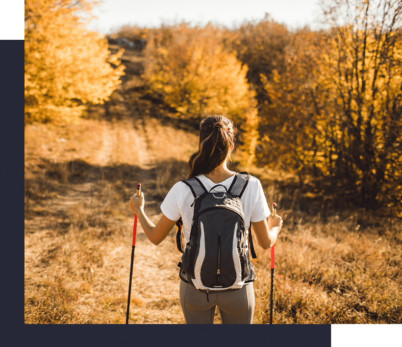 Woman lying on a faux-fur rug covering her face.